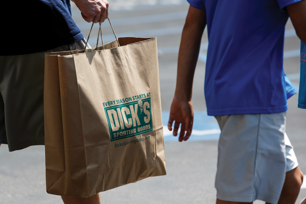 walkers carrying paper bag