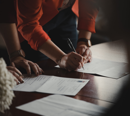 People signing documents